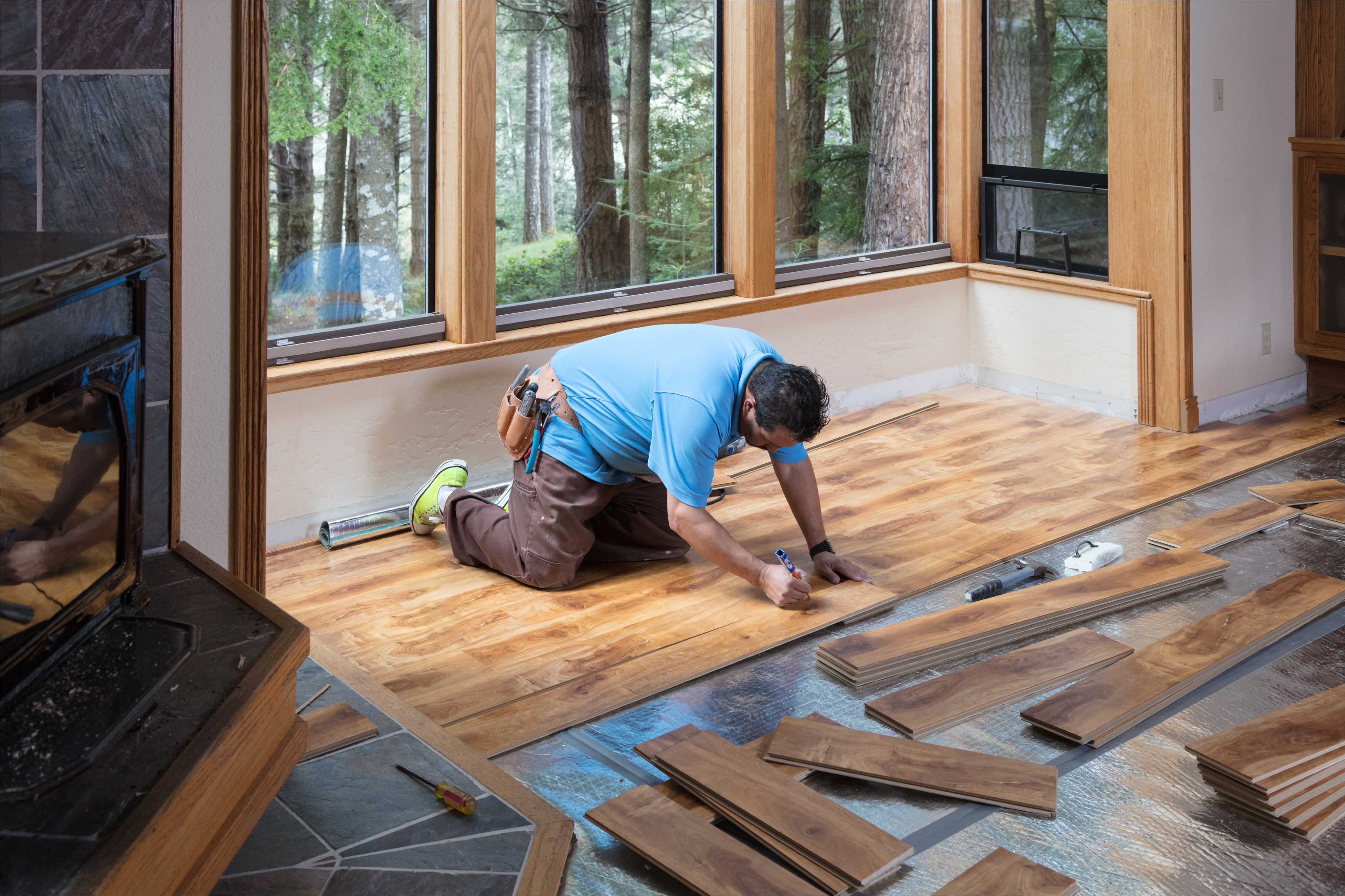 Contractor installing wood flooring